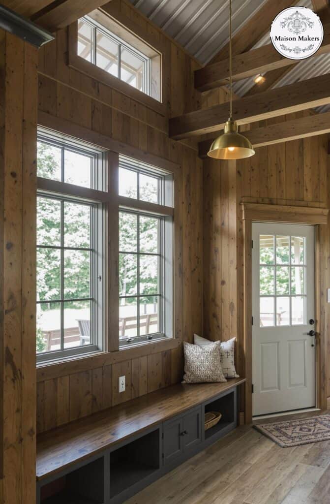 small barndominium with large windows is ideal for barndominiums seeking natural light and style. Whether floor-to-ceiling or arch, these window designs bring the outside in beautifully.