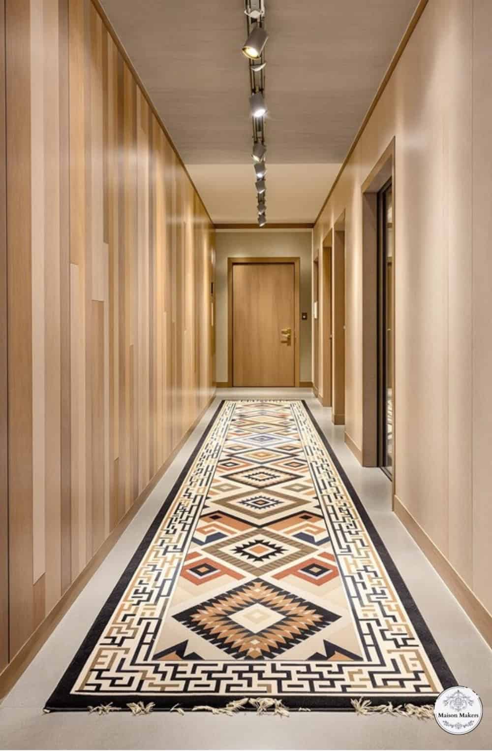 a long hallway with a rug on the floor