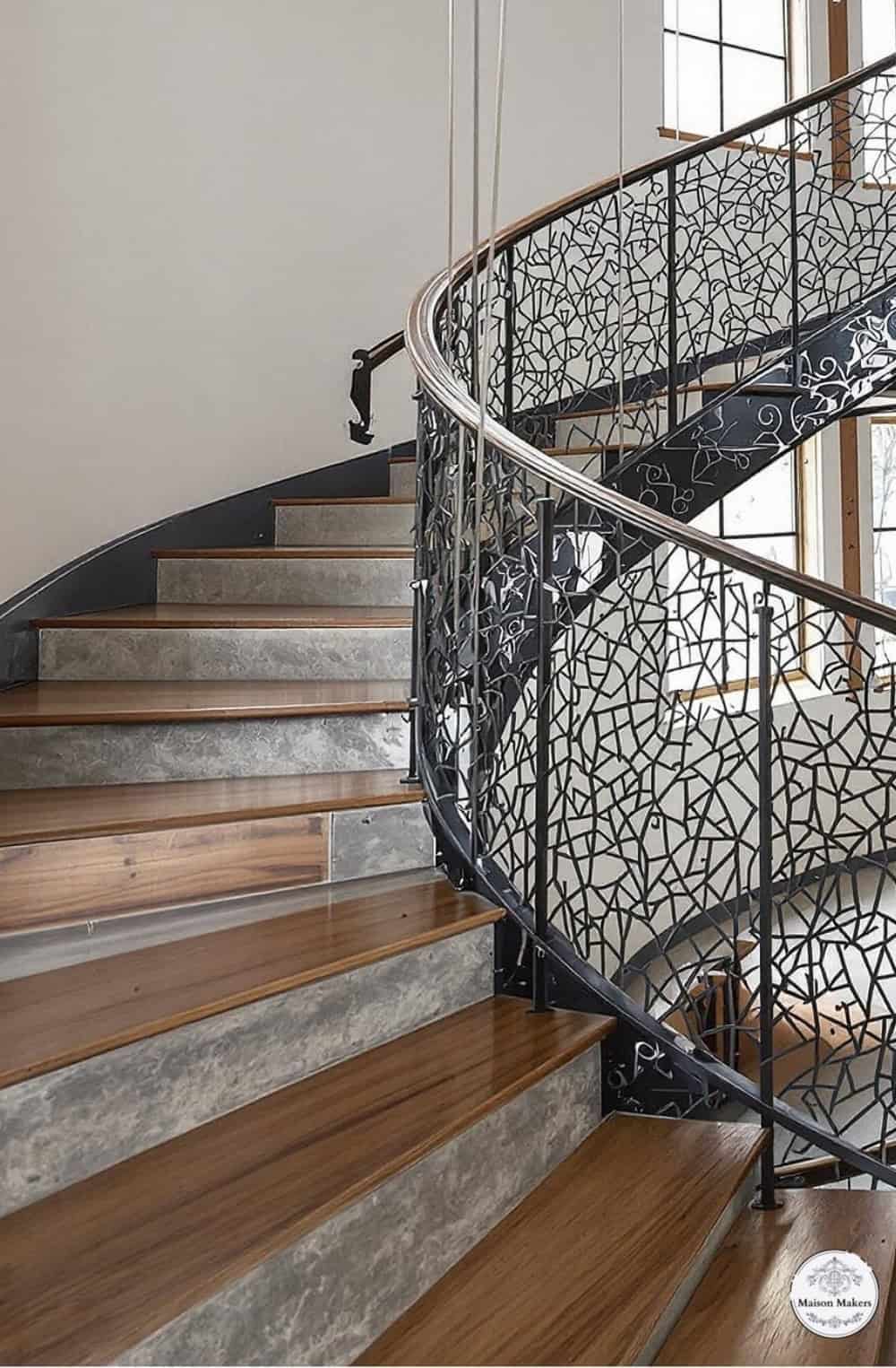 a spiral staircase in a home with wood floors