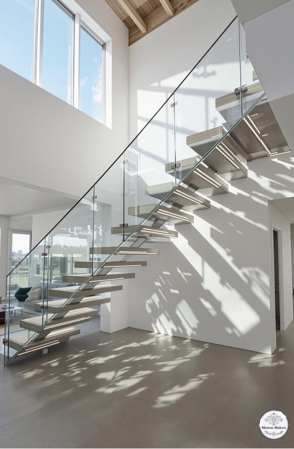 a staircase in a house with a glass railing