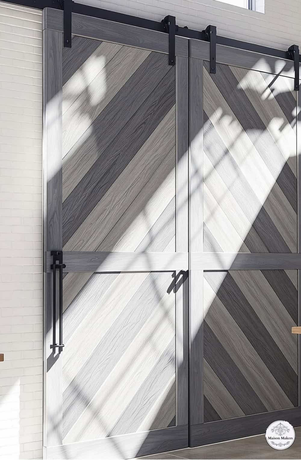 a large wooden door with a metal frame