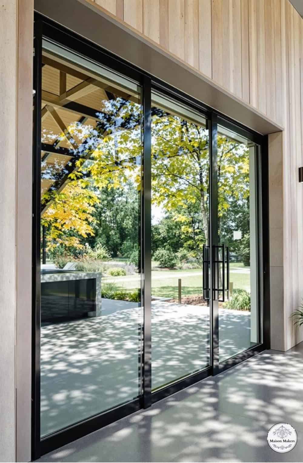 a large glass door leading to a patio