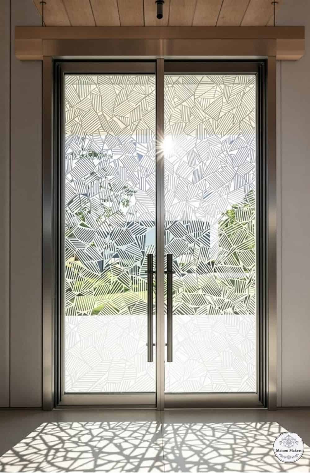 a large glass door with a wooden frame