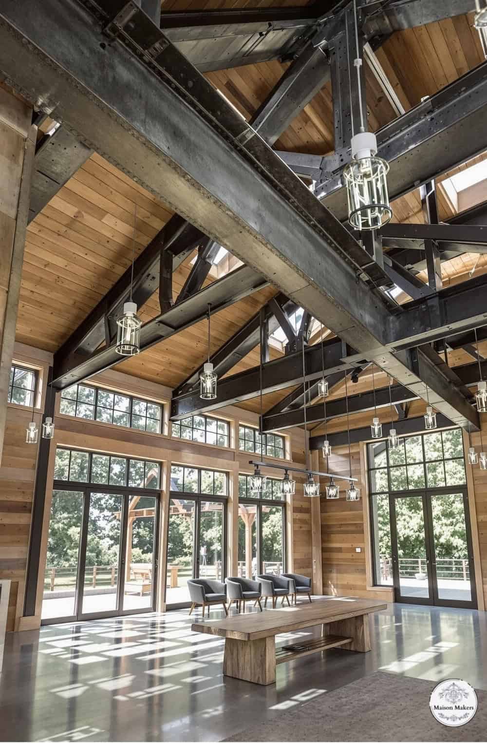 a large room with a wooden ceiling and windows