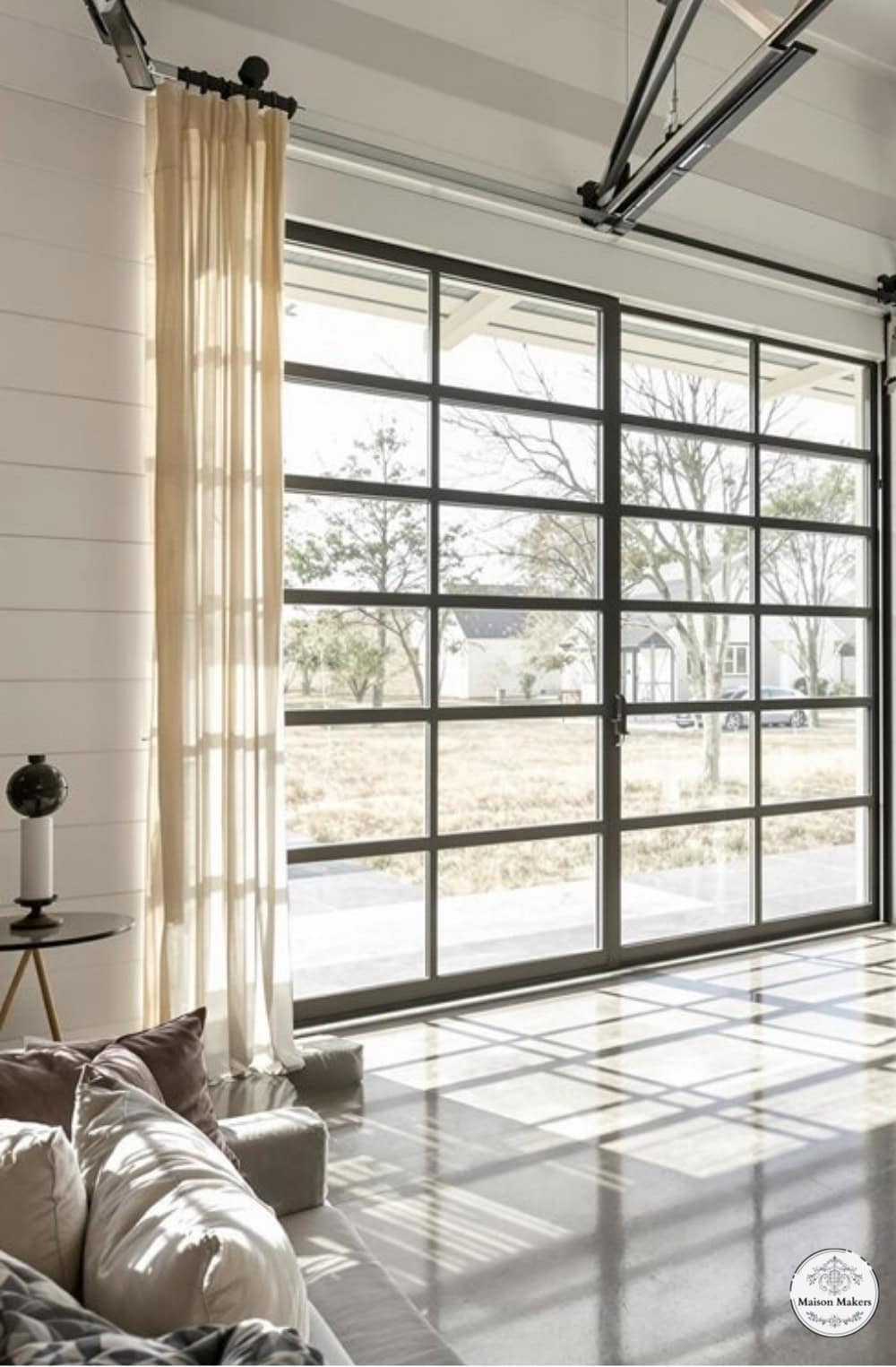 a living room filled with furniture and a sliding glass door