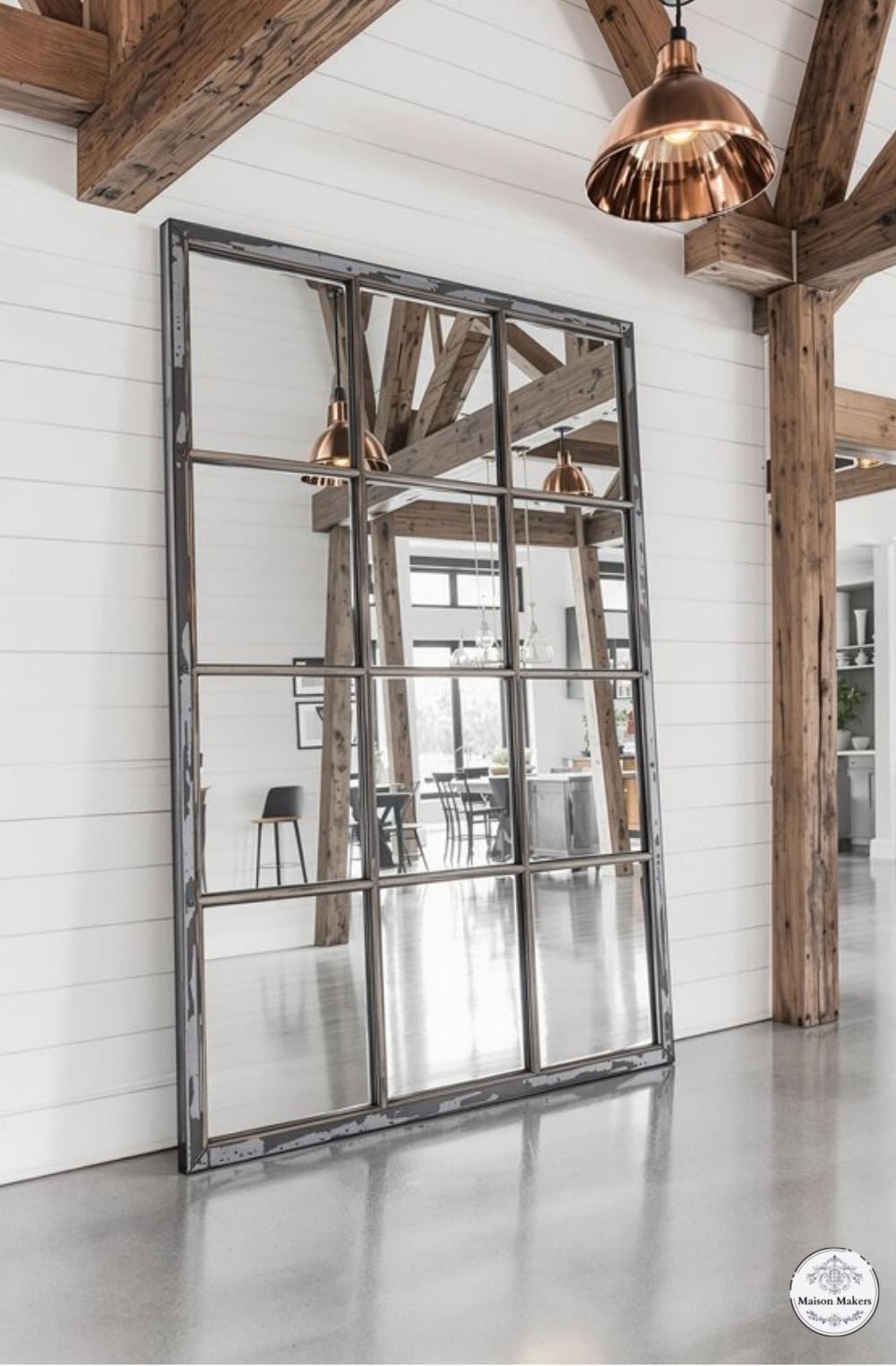 a large mirror hanging on the wall in a room