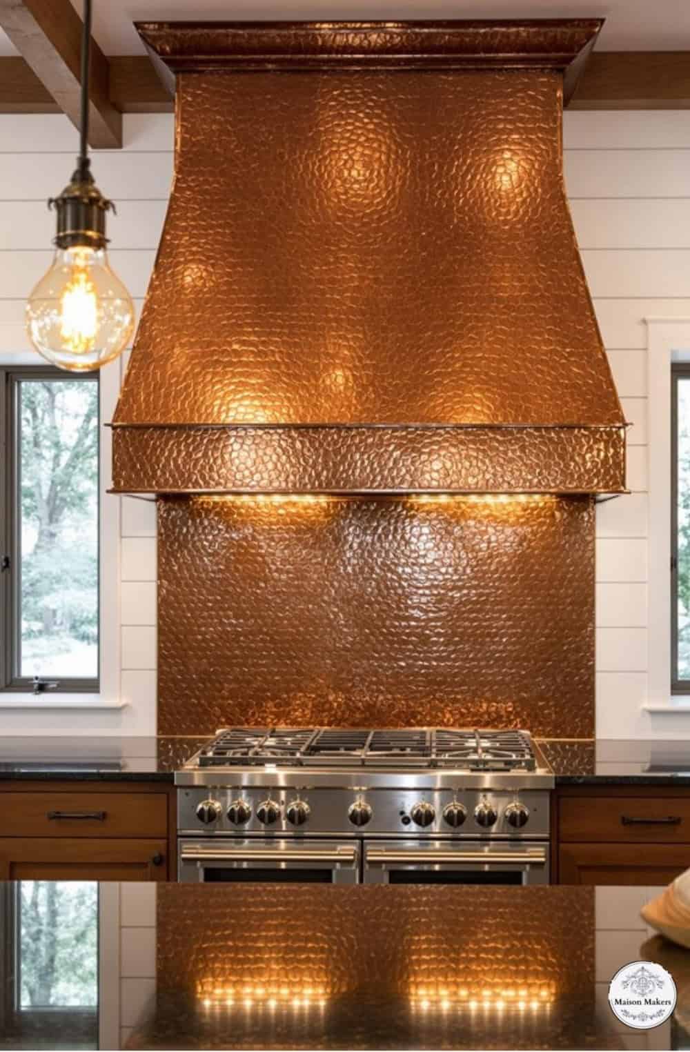 a kitchen with a large copper stove top