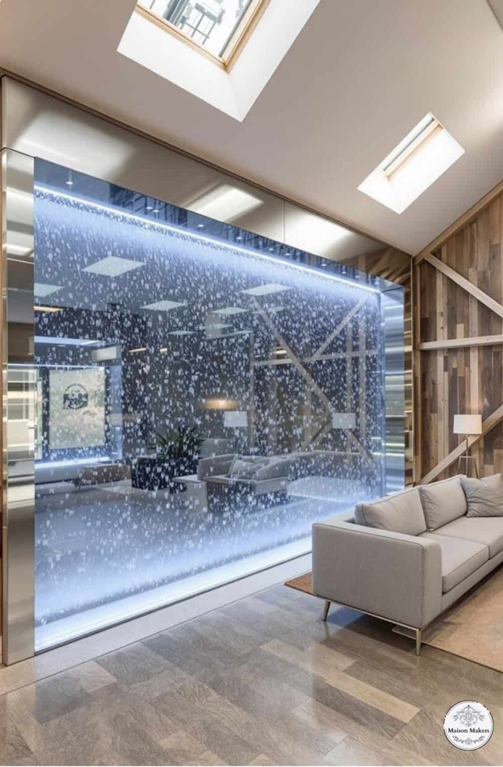 a living room filled with furniture and a skylight