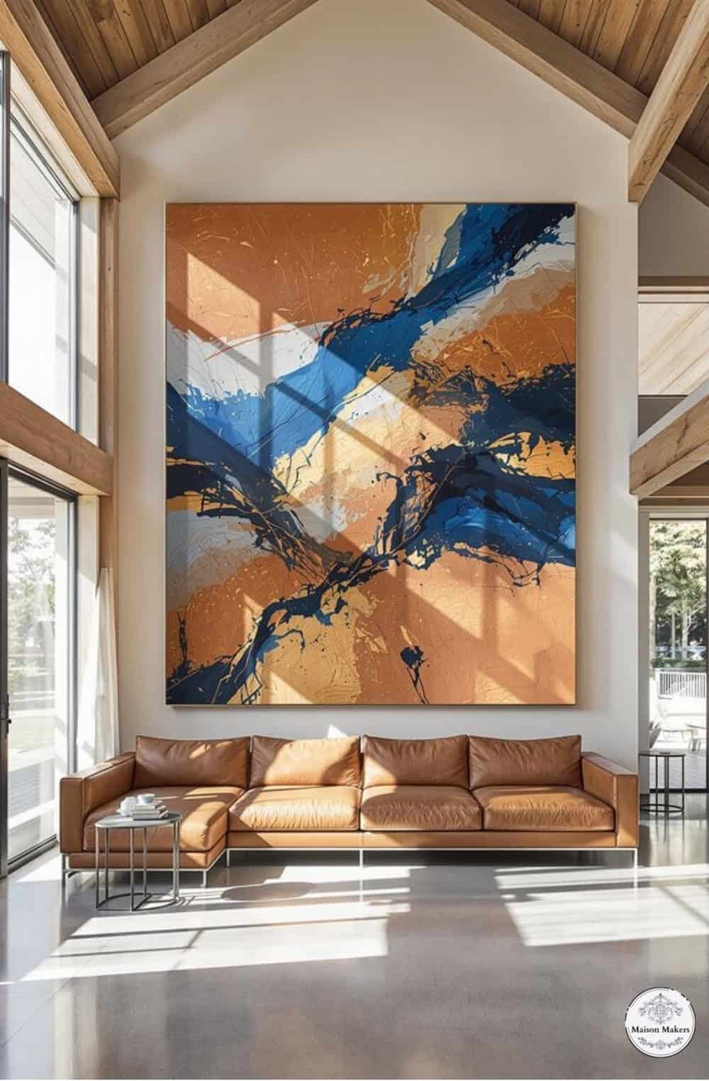a living room with a large painting on the wall