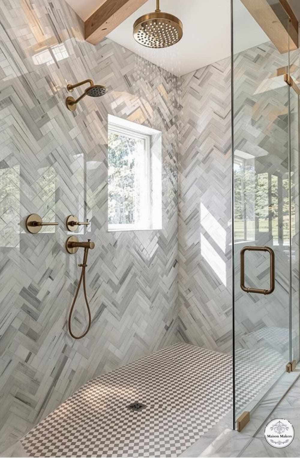 a bathroom with a walk in shower next to a window
