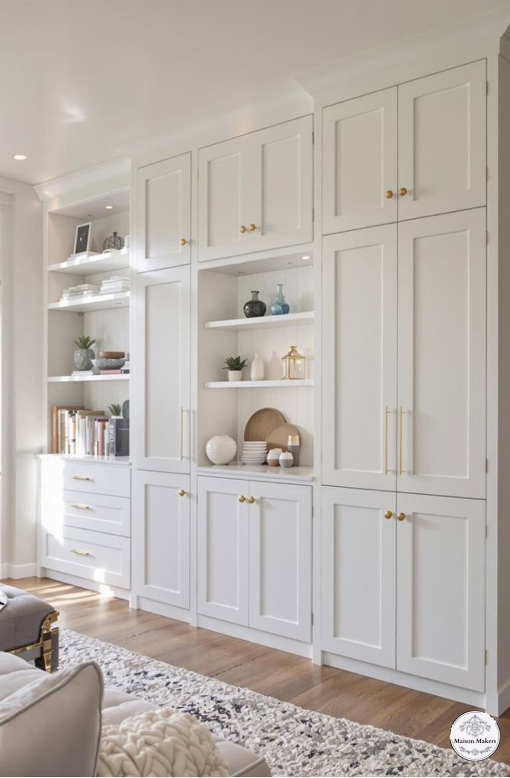 a living room filled with lots of white furniture