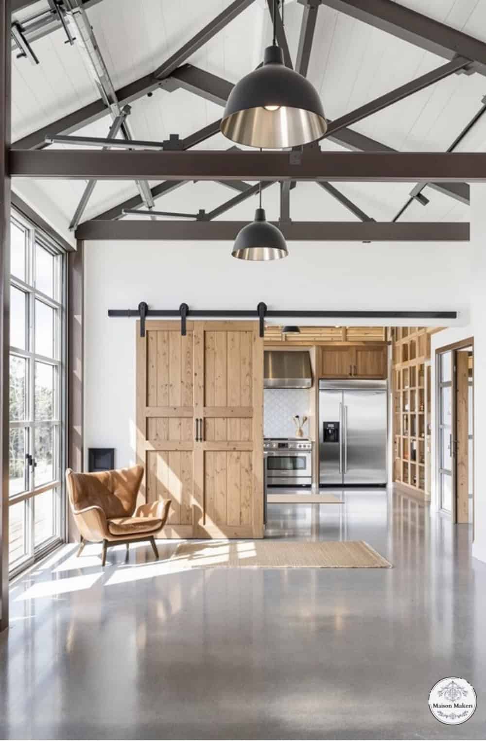 a large open room with a couch and a chair