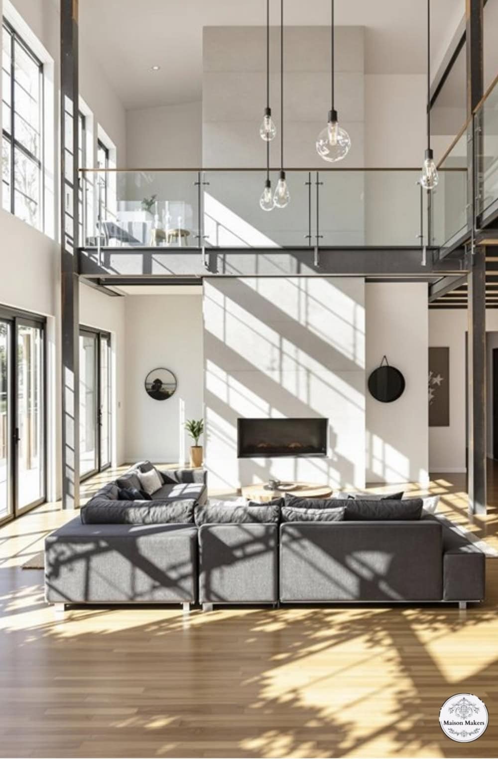 a living room filled with furniture and lots of windows
