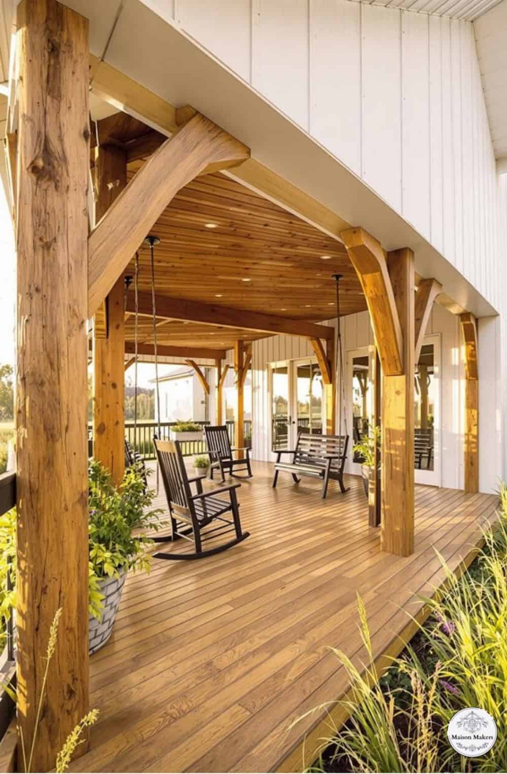 a wooden porch with rocking chairs on it
