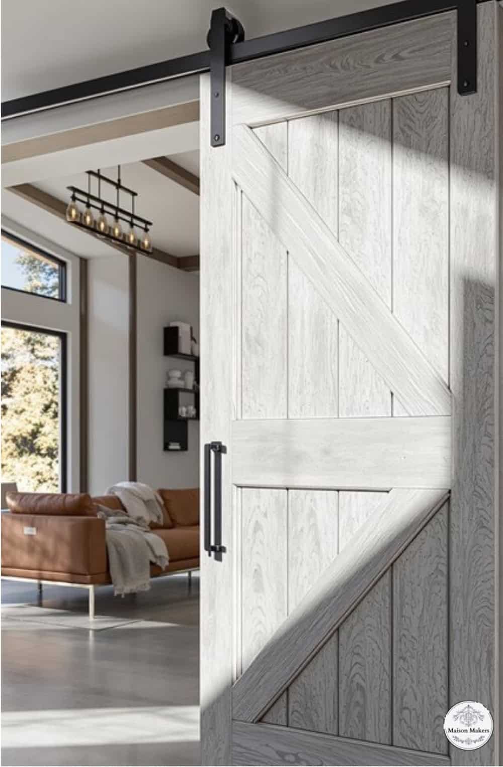 a white barn door with a sliding barn door