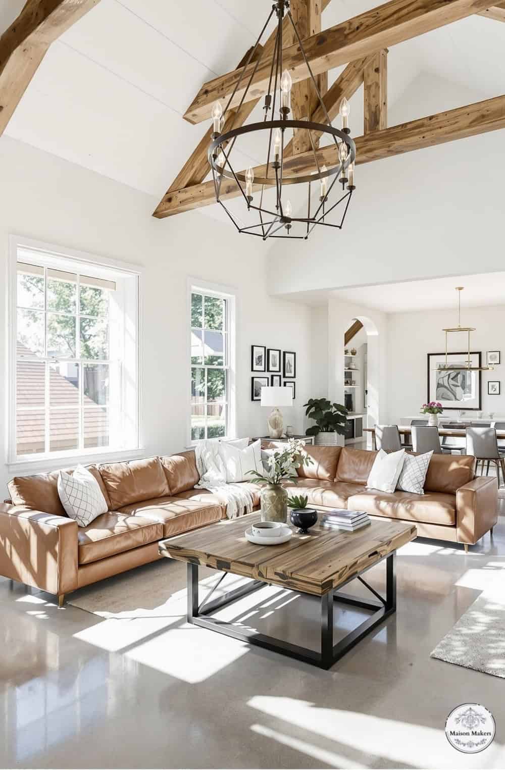 a living room filled with furniture and a chandelier