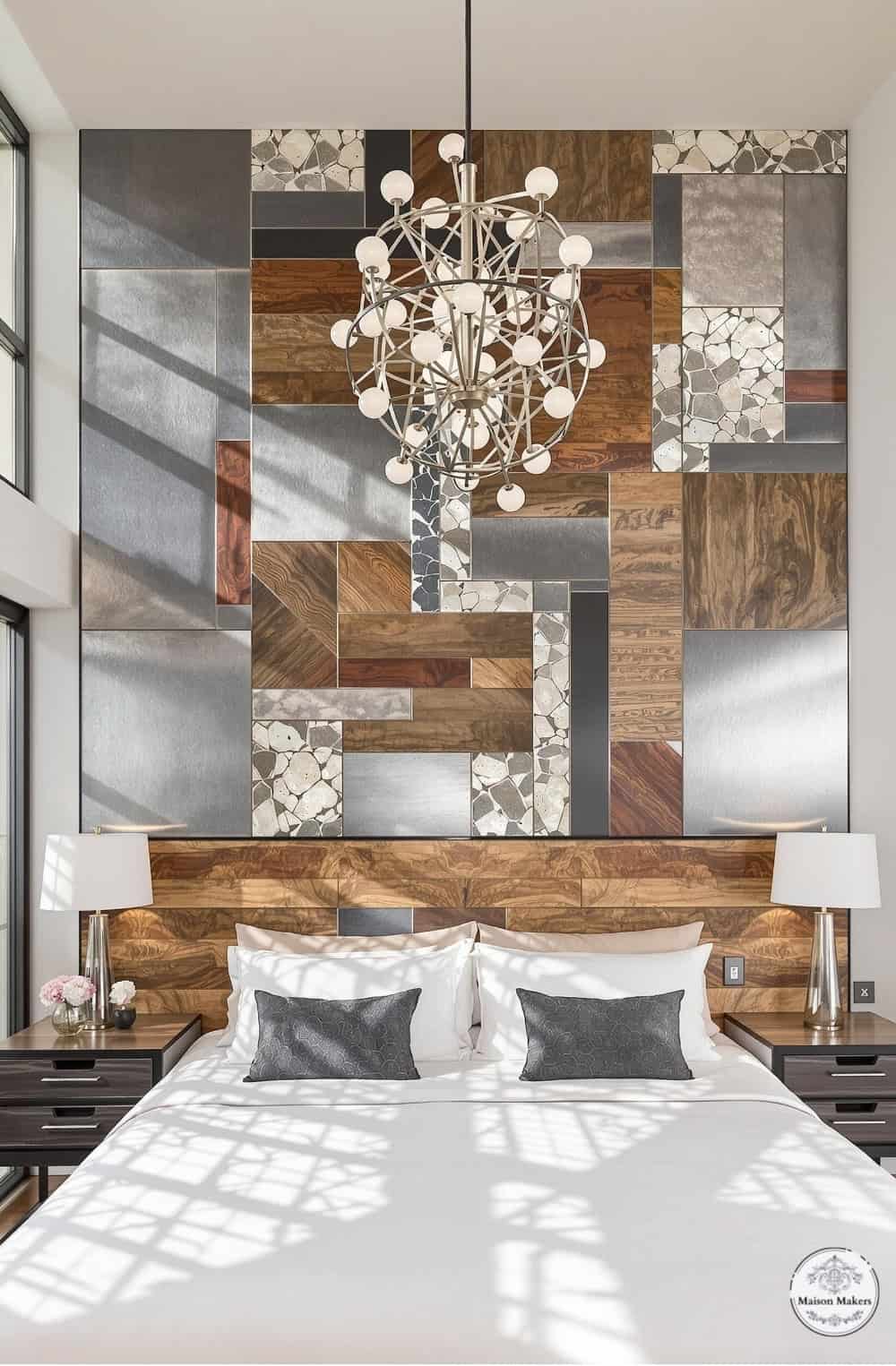 a bed with a white comforter and a chandelier