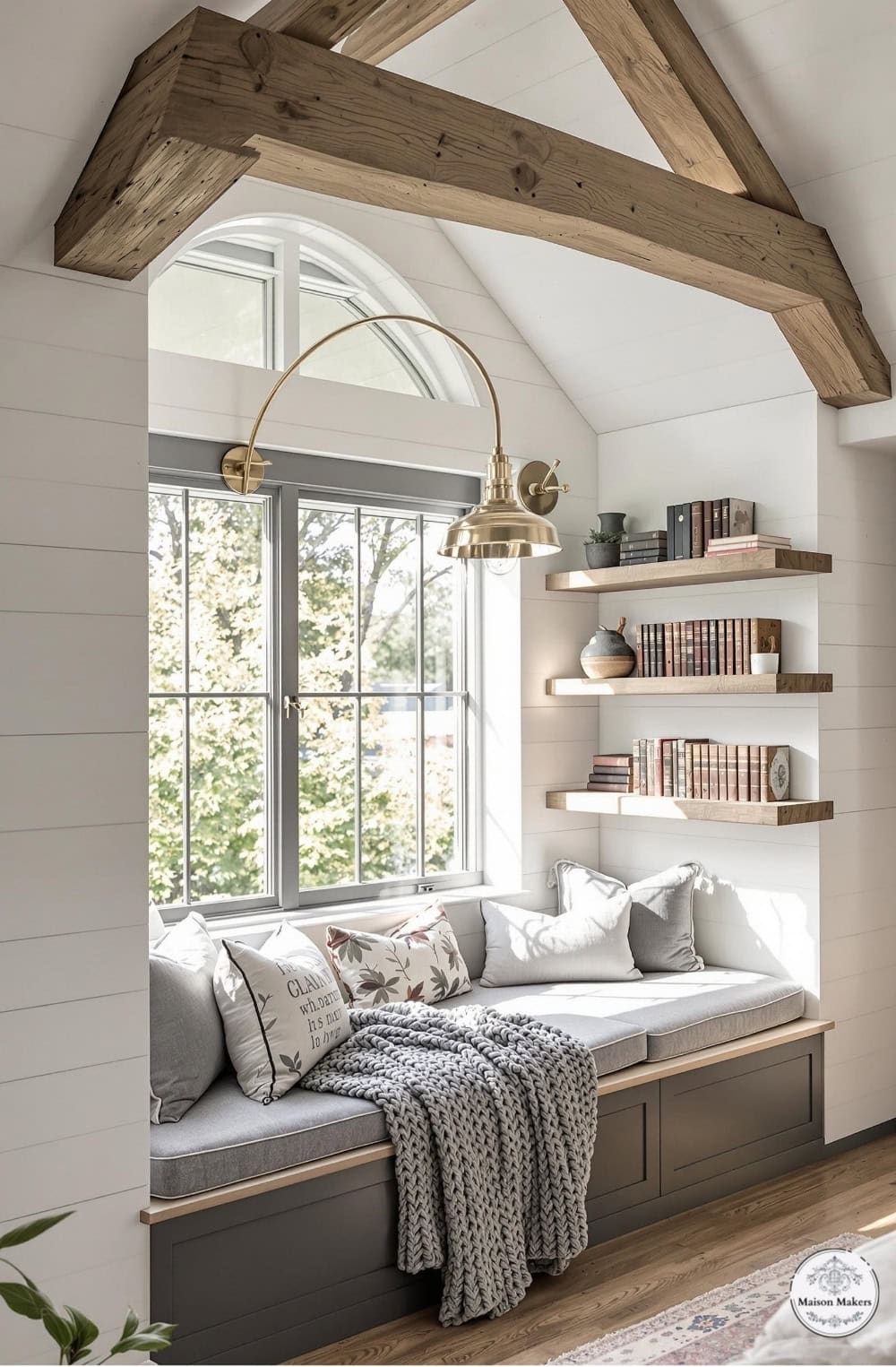 a window seat with a blanket on it