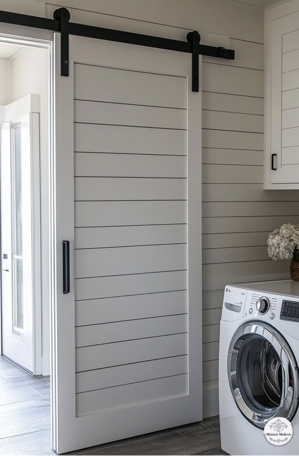 a laundry room with a washer and dryer