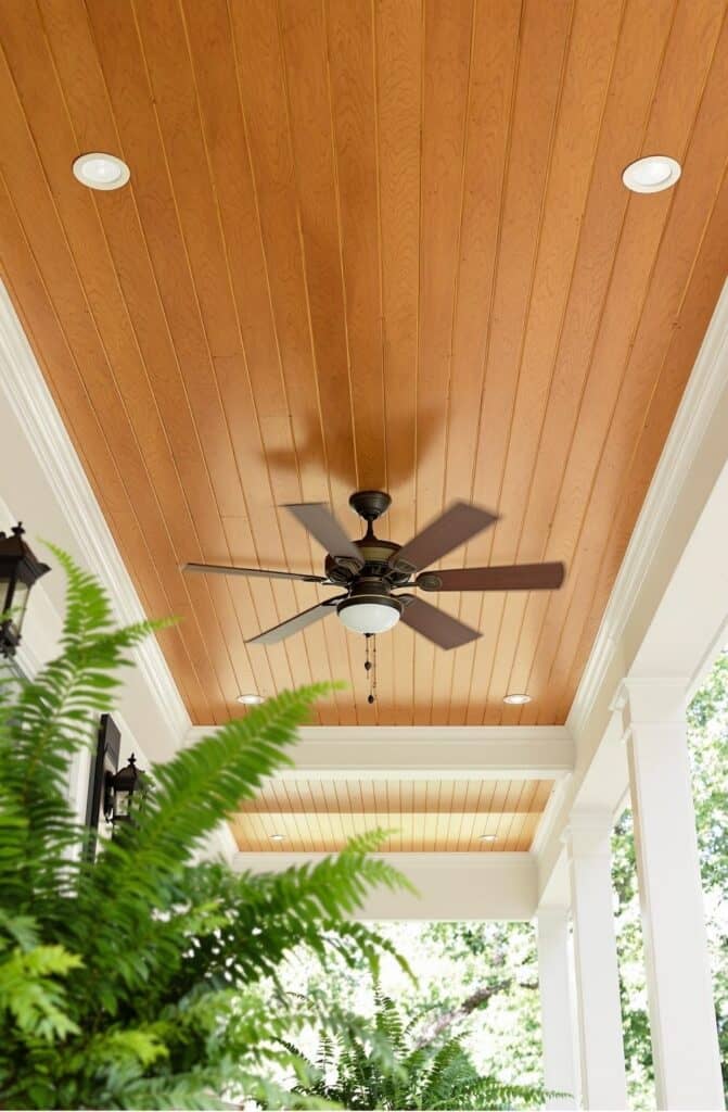 a ceiling fan mounted to a wooden ceiling