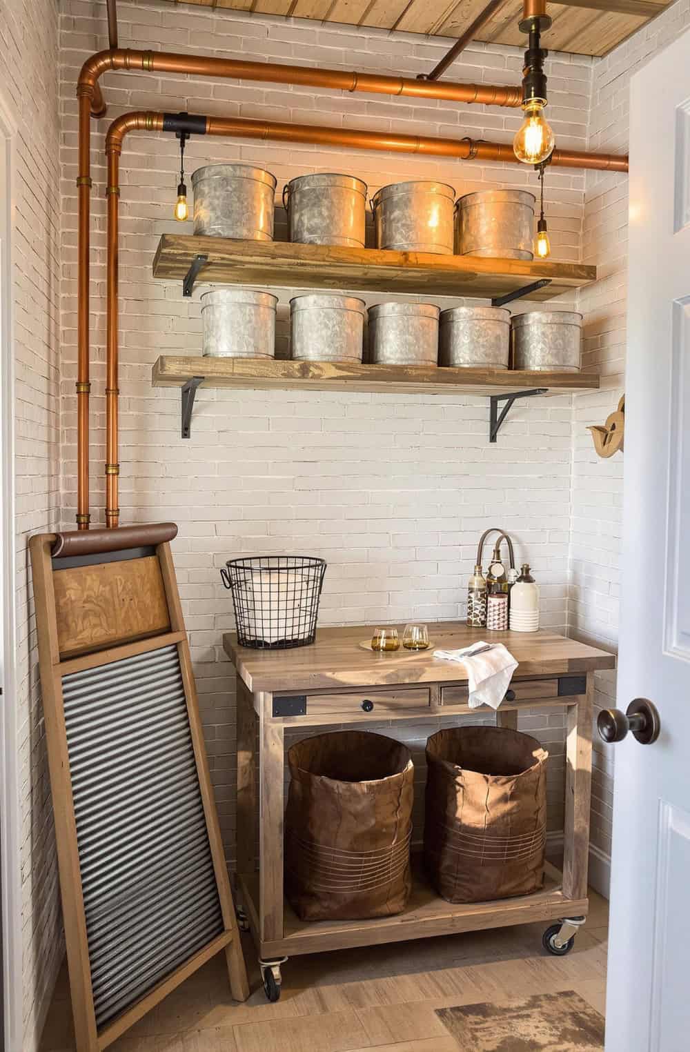 a kitchen area with a sink and shelves