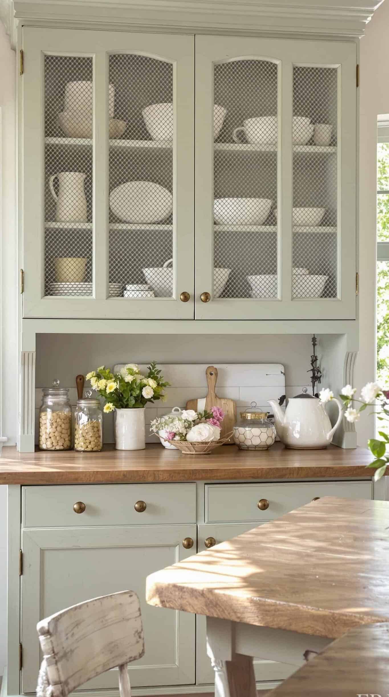 a kitchen filled with lots of white dishes