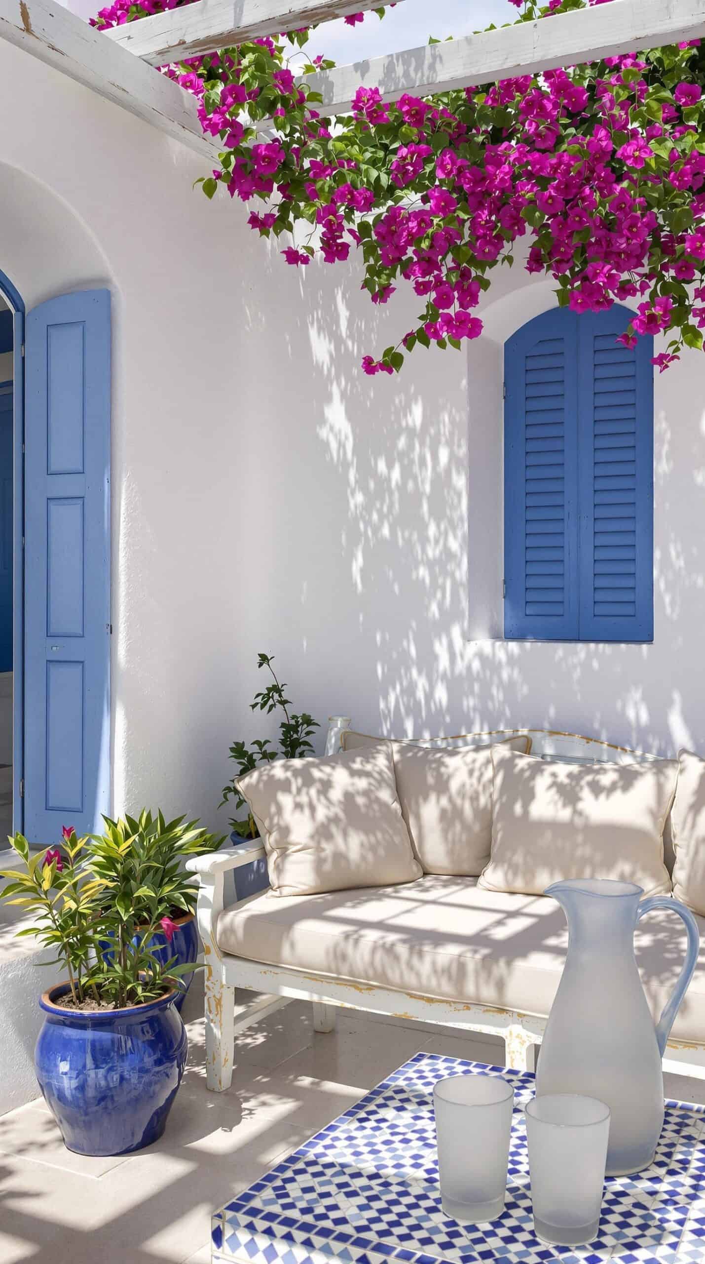 a white couch sitting under a blue and white awning