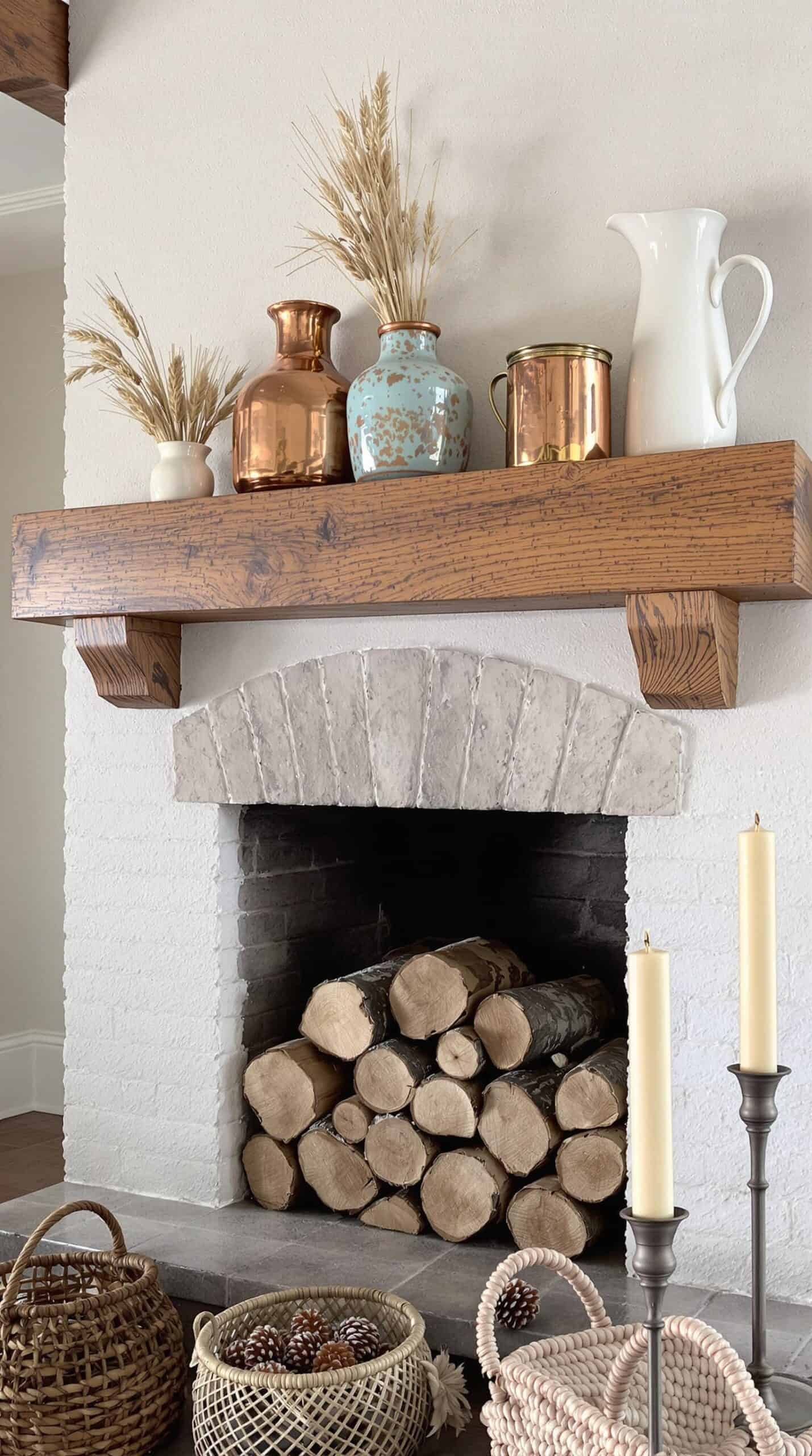 a fireplace with a bunch of logs on top of it