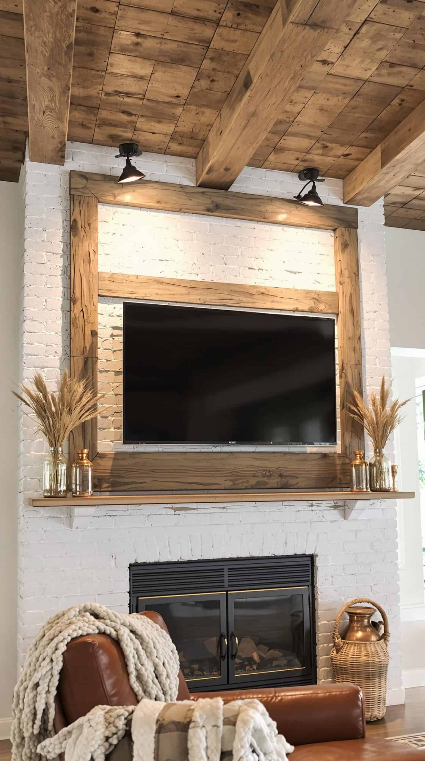 a living room with a fireplace and a flat screen tv