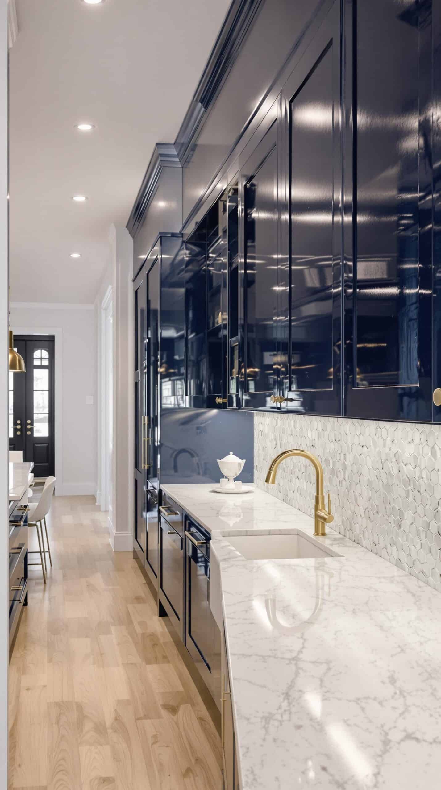 a kitchen with a marble counter top and black cabinets