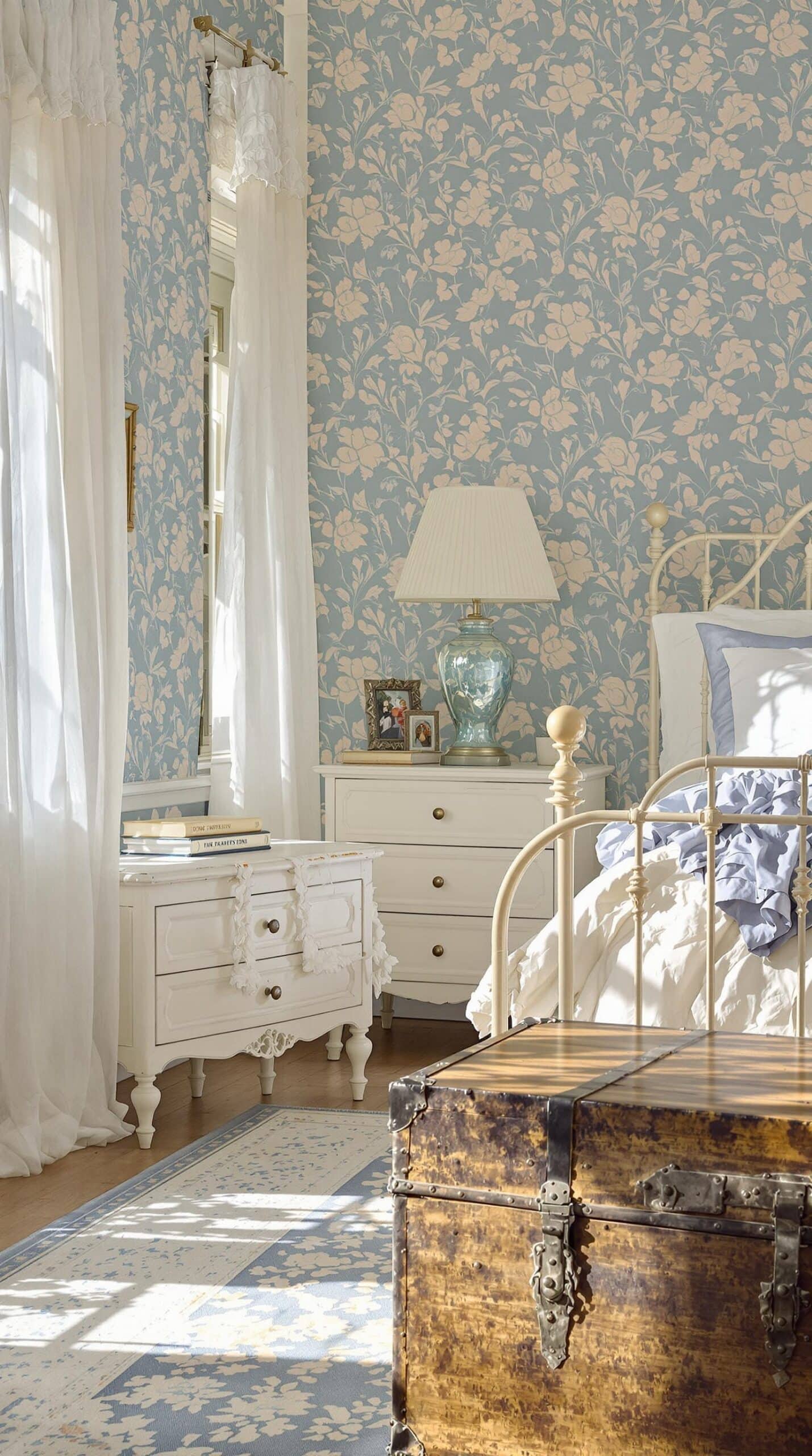 a bedroom with a bed, dresser, and mirror