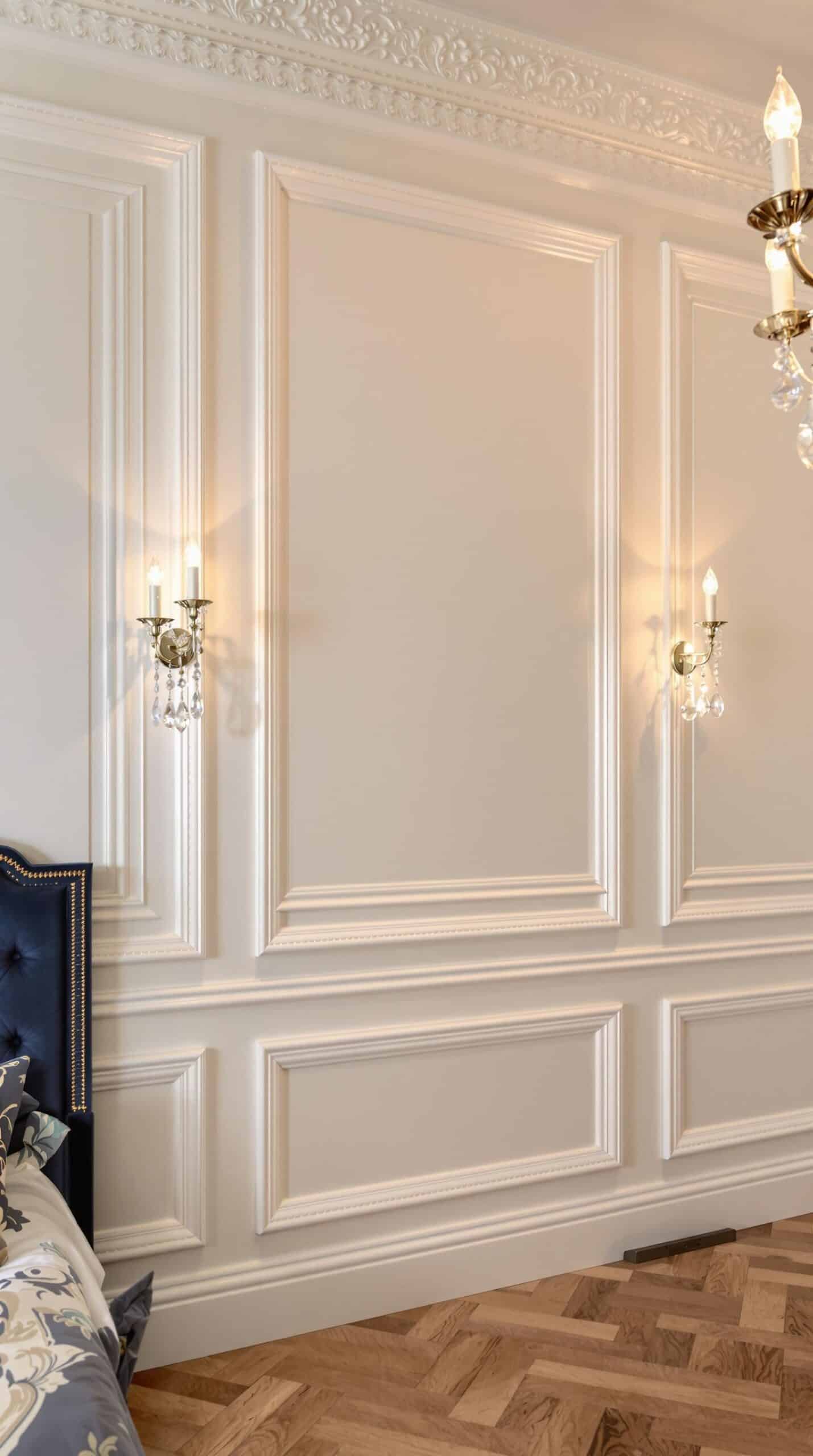 a bedroom with a chandelier and a bed