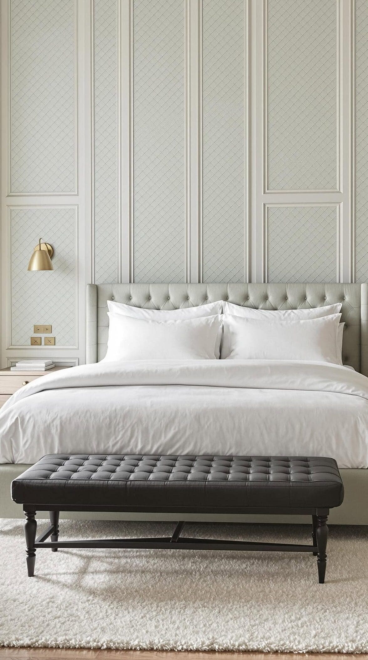 a bedroom with a large bed and a bench