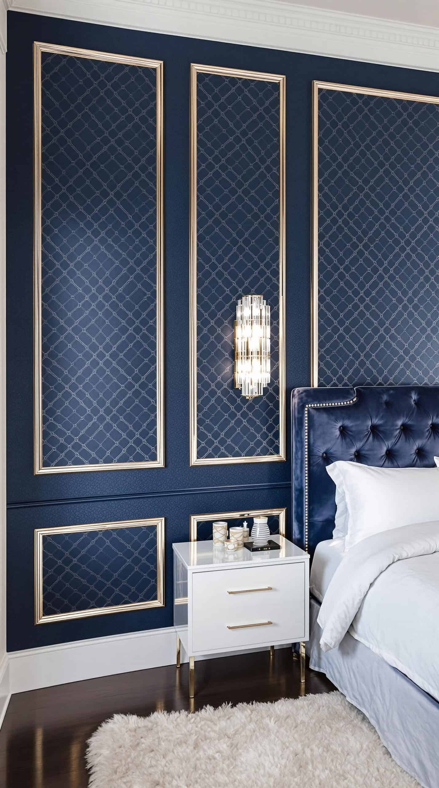 a bedroom with blue walls and a white bed