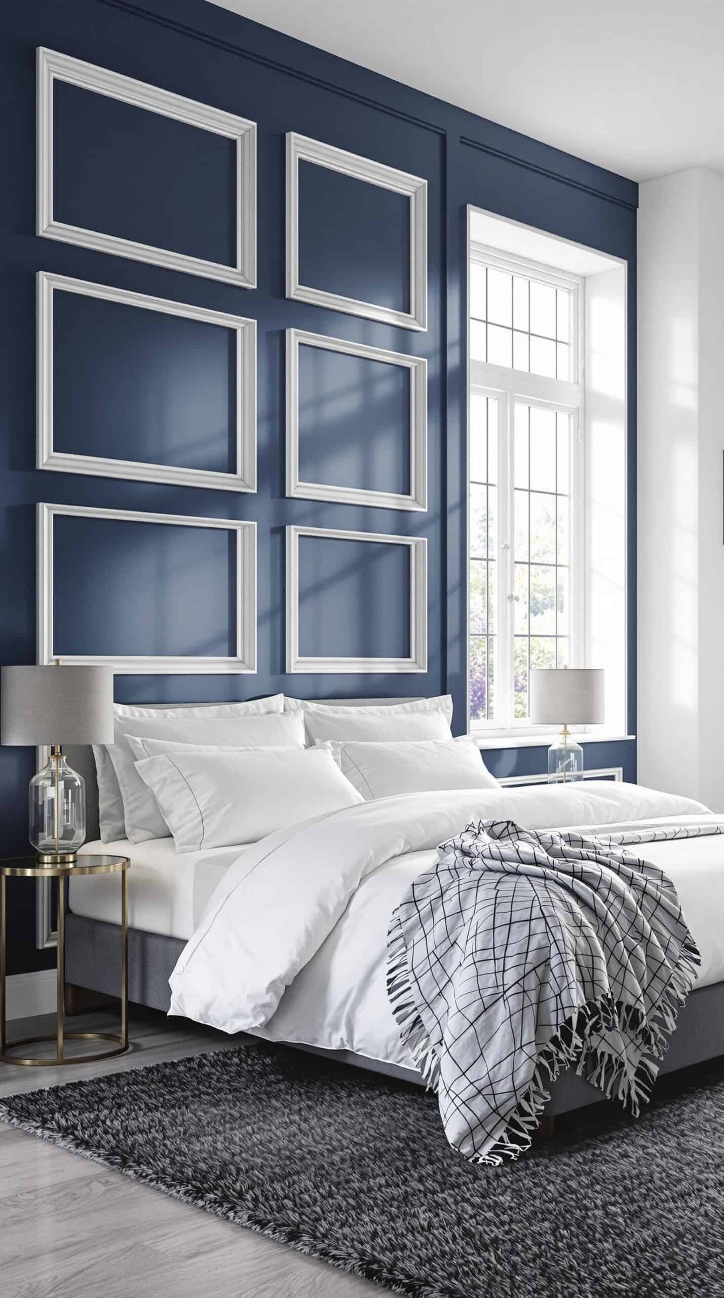 a bedroom with blue walls and a white bed